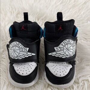 Jordan Kids Black and White Sneakers with Blue Accents